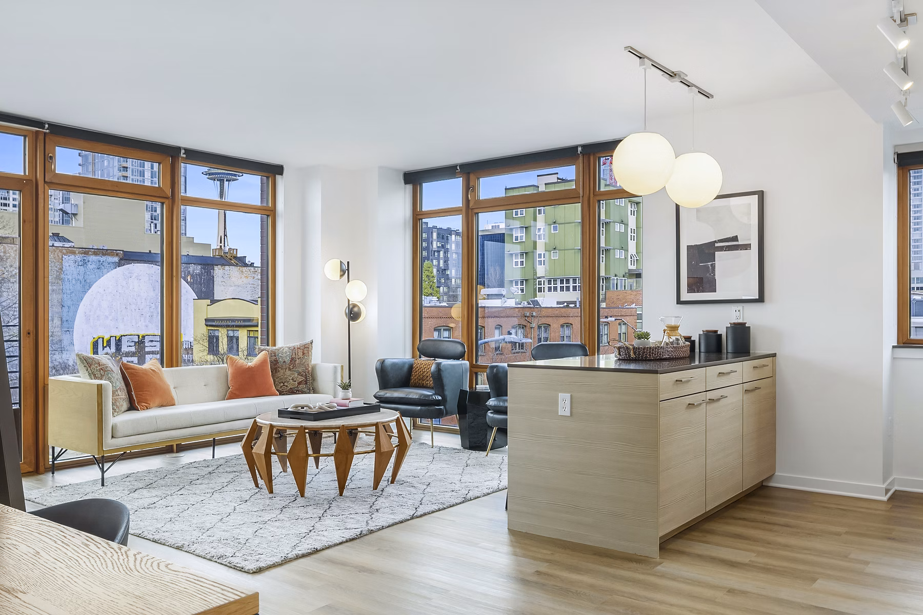 Spacious living room with modern decor at The Goodwin Apartments, featuring luxury finishes and ample natural light