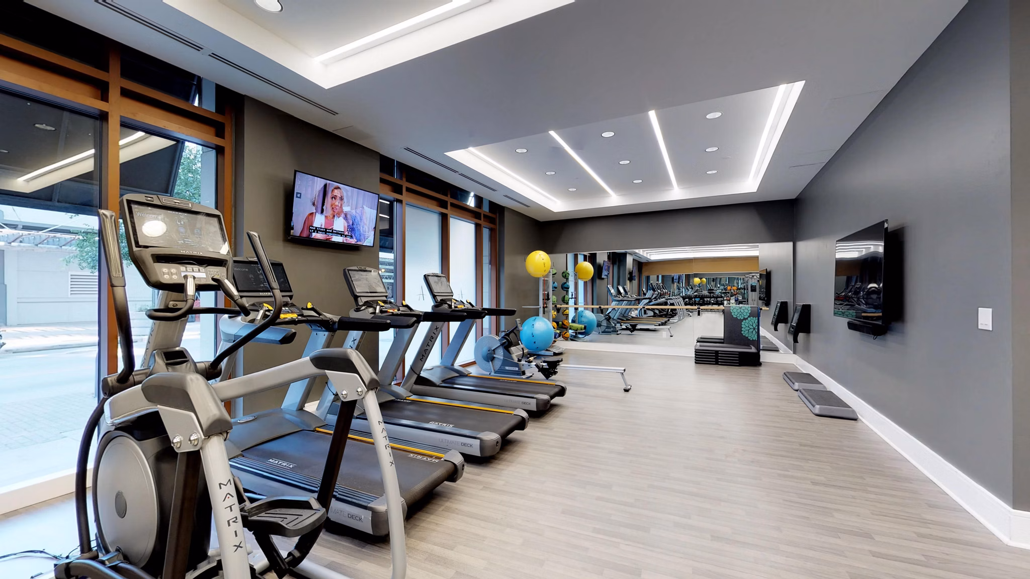 State-of-the-art fitness center with modern equipment at Ashton Austin Apartments in a luxurious setting for active living