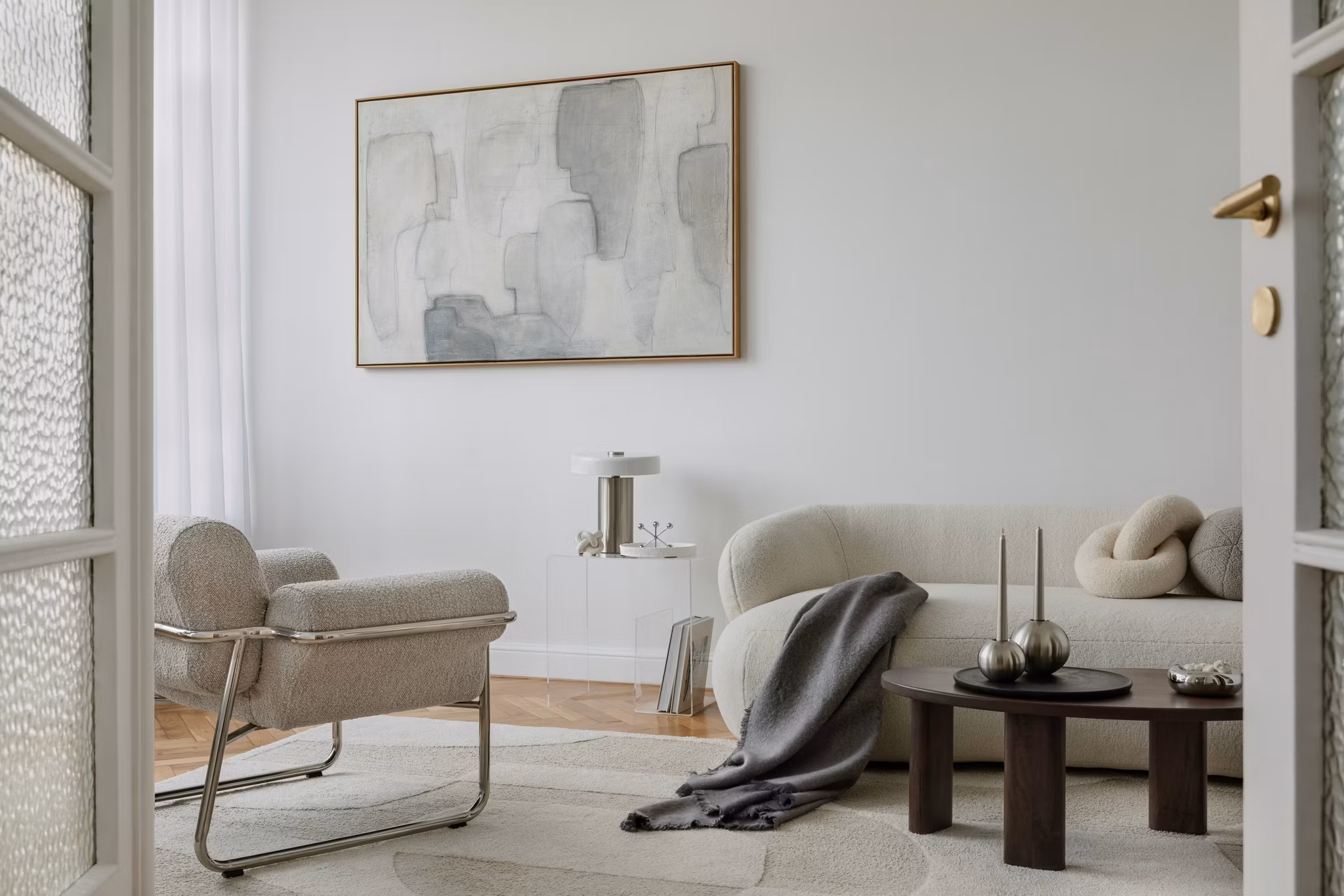 A well-balanced interior scene with warm textures, a modern sofa, and curated decorative objects that create a harmonious and sophisticated aesthetic.